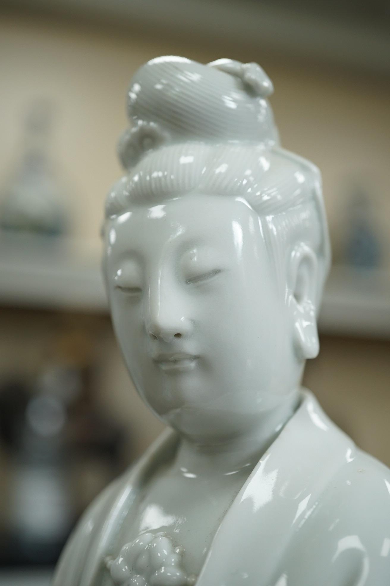 A Chinese blanc-de-chine seated figure of Guanyin, late 19th/early 20th century